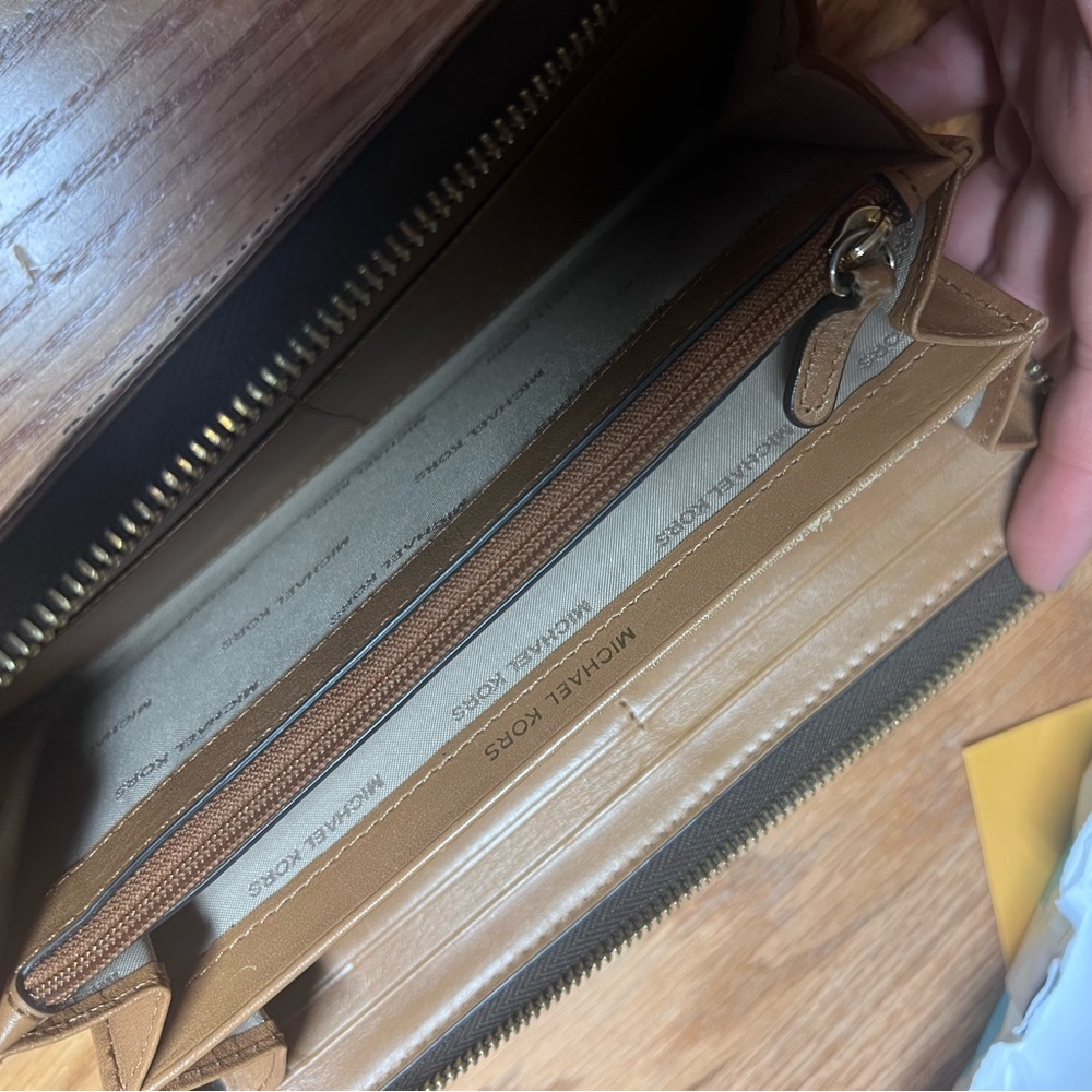 Brown Mk Wallet never used. My wife doesn’t like it so thought I’d try to sell
